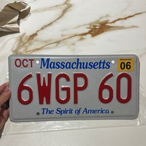 Massachusetts License Plate with Red and Blue Text